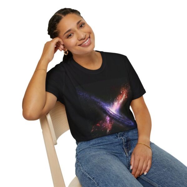 Woman sitting in a chair wearing Erupting Quasar JWST Unisex Softstyle T-shirt in black